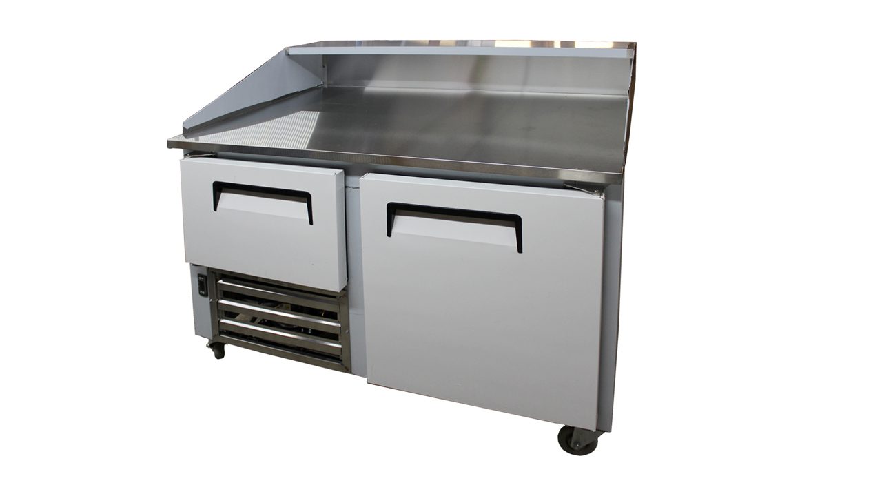 A stainless steel counter with two drawers and one cabinet.