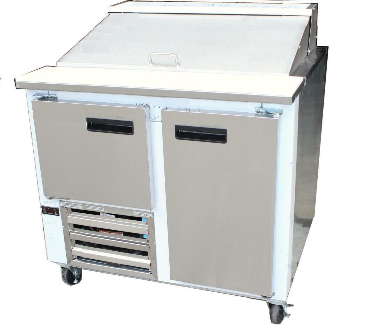 A stainless steel refrigerator with two doors and four drawers.
