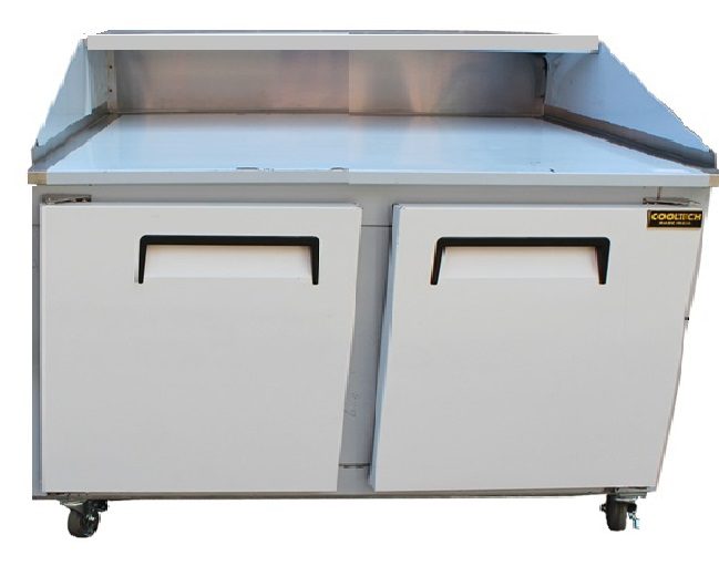 A stainless steel counter with two drawers and wheels.
